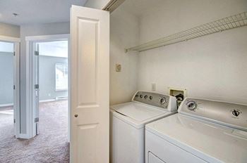 a laundry room with one washers and a dryer